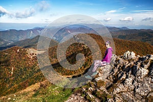 Girl hiker on top of the hill Klak in Slovakia