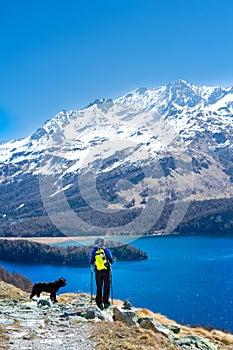 Girl in hiking mountain with her faithful dog