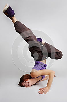 Girl in hip-hop clothes making freeze