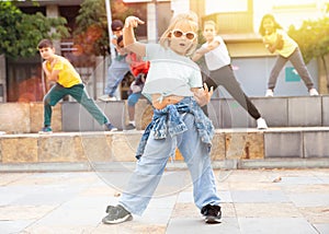 Girl hip hop dancer posing outdoors