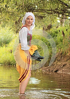 Girl in historical dress in water