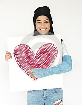 Girl hold a heart drawing on paper photo