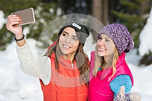 Girl Hold Smart Phone Camera Taking Selfie Photo Snow Forest Young Woman Couple Outdoor Winter
