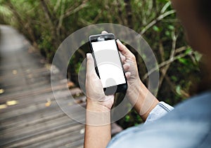 Girl hold smart phone walking on road