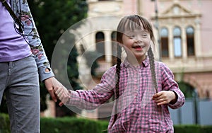 Girl holding arms of the sister