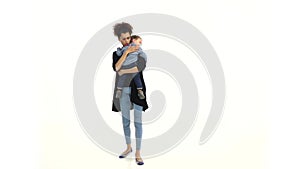 Girl is holding the baby, he has a nipple, he was crying. White background. Slow motion