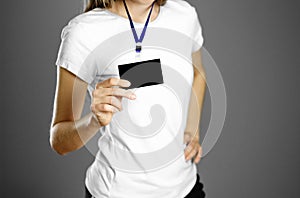 Girl holding a badge. Close up. Isolated background