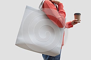 Girl is holding bag canvas fabric for mockup blank template