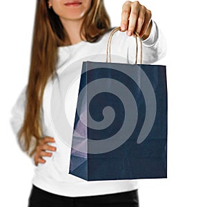 Girl holding a blue gift bag. Close up. Isolated on white background