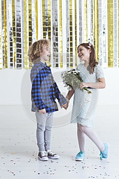 Girl holding bouquet of flowers