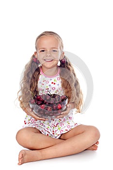 Girl holding a bowl of ripe cherries