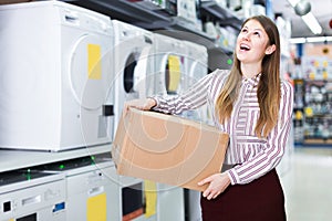 Girl holding box with purchase