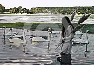 A girl holding the bulrush and calling a white swans