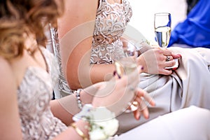 Girl is holding a champagne glass