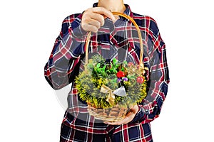 Girl holding a christmas decoration basket