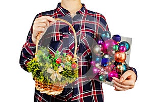 Girl holding christmas decoration basket and toys