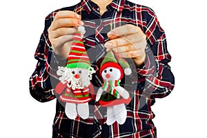 Girl holding christmas figurine dolls