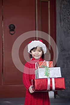 Girl Holding Christmas Gifts