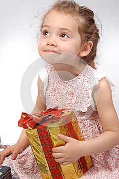 Girl holding a Christmas present