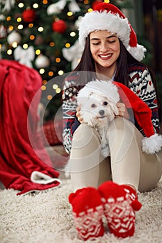 Girl holding a Christmas present puppy dog