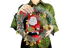 Girl holding christmas wreath decoration