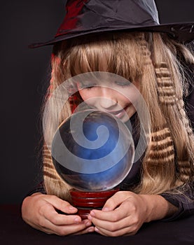 Girl holding crystal ball.