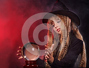 Girl holding crystal ball.