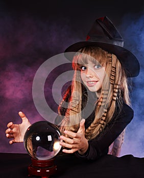 Girl holding crystal ball.