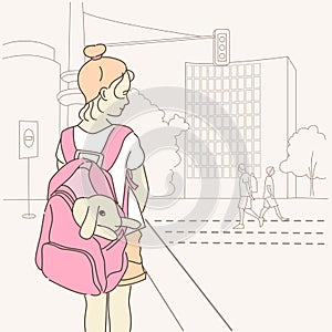 Girl is holding a cute little rabbit in backpack