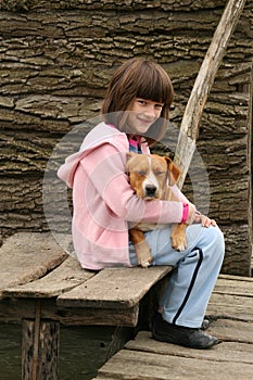 Girl holding a dog