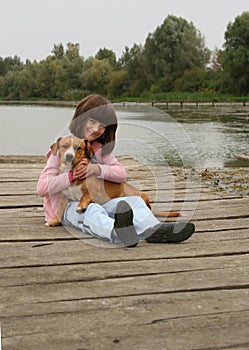 Girl holding a dog