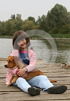 Girl holding a dog