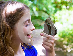 Girl holding finger Blue Monrpho Butterfly Peleides