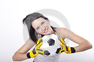 Girl holding a football.