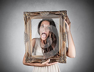 Girl holding a frame