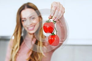 Girl holding fresh cherry tomato,healthy diet