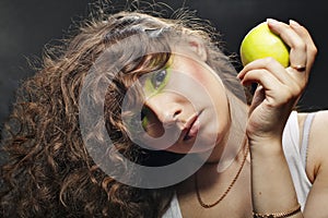 Girl holding a green apple