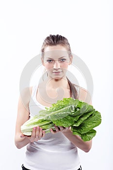 Girl holding a green salad