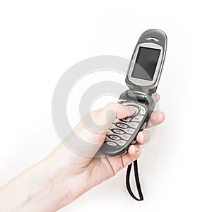 Girl is holding in hand retro flip flop mobile phone