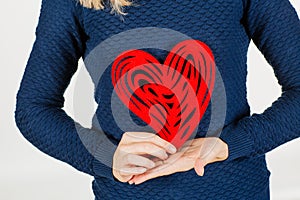 Girl holding heart Valentine day symbol. Heart. Love symbol. Iso