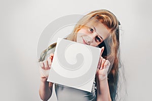 Girl holding in her hands square mock up poster.