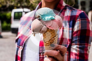 Girl Holding ice cream in the cone