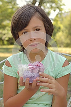 Girl holding ice cream tub