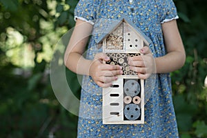 Girl holding insect hotel