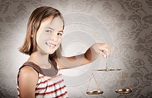 Girl holding justice scale