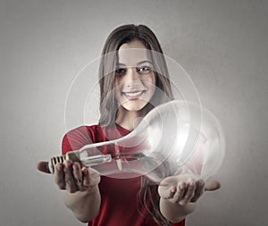 Girl holding a lightbulb