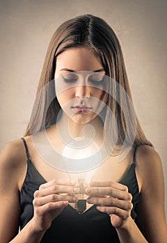 GIrl holding a lightbulb