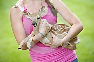 Girl Holding Little Fawn