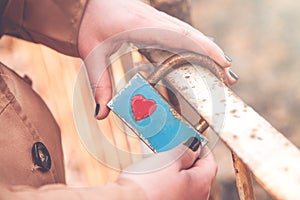 Girl holding lock. Love and fidelity symbol.