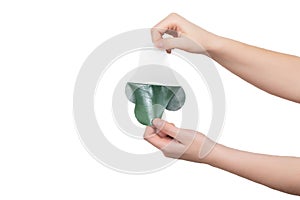 Girl holding a medical anesthetic plaster for the back in her hands on a white background, isolate. Spinal pain treatment concept